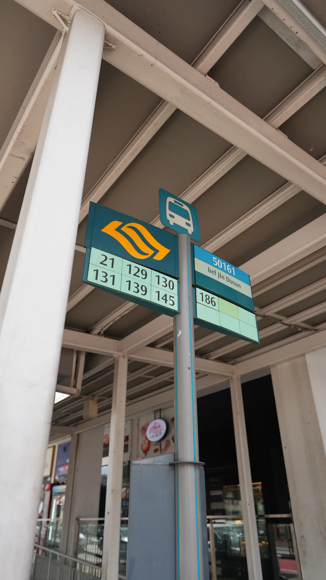 Bus stop 50161, before Jalan Dusun, showing services 21, 129, 130, 131, 139, 145 and 186